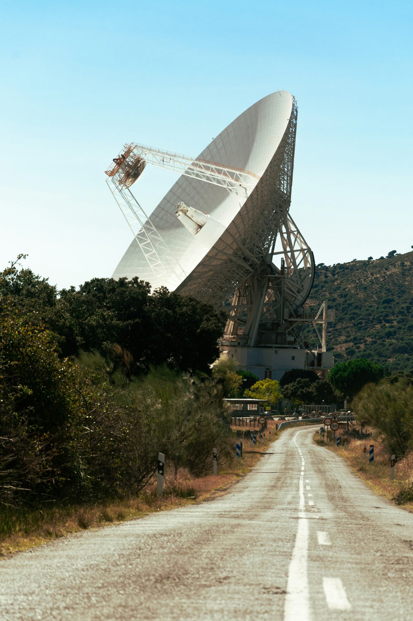 white satellite dish on green grass field during daytime